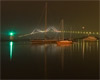Newport Harbor Light and Pell Bridge night fog